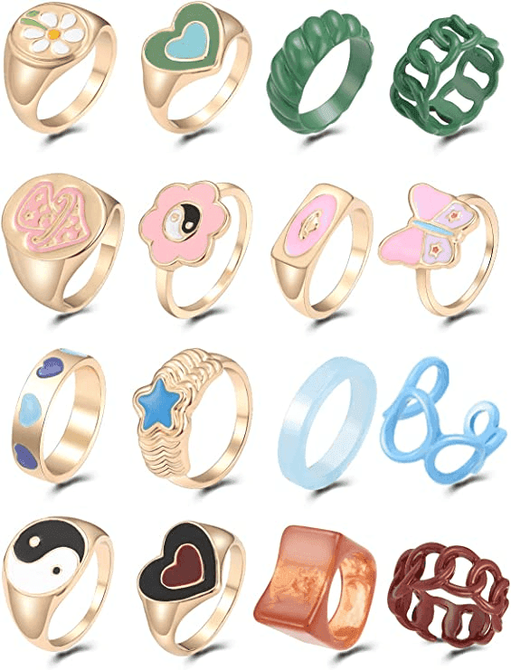 Gold rings and jewelry accessories styled on hand